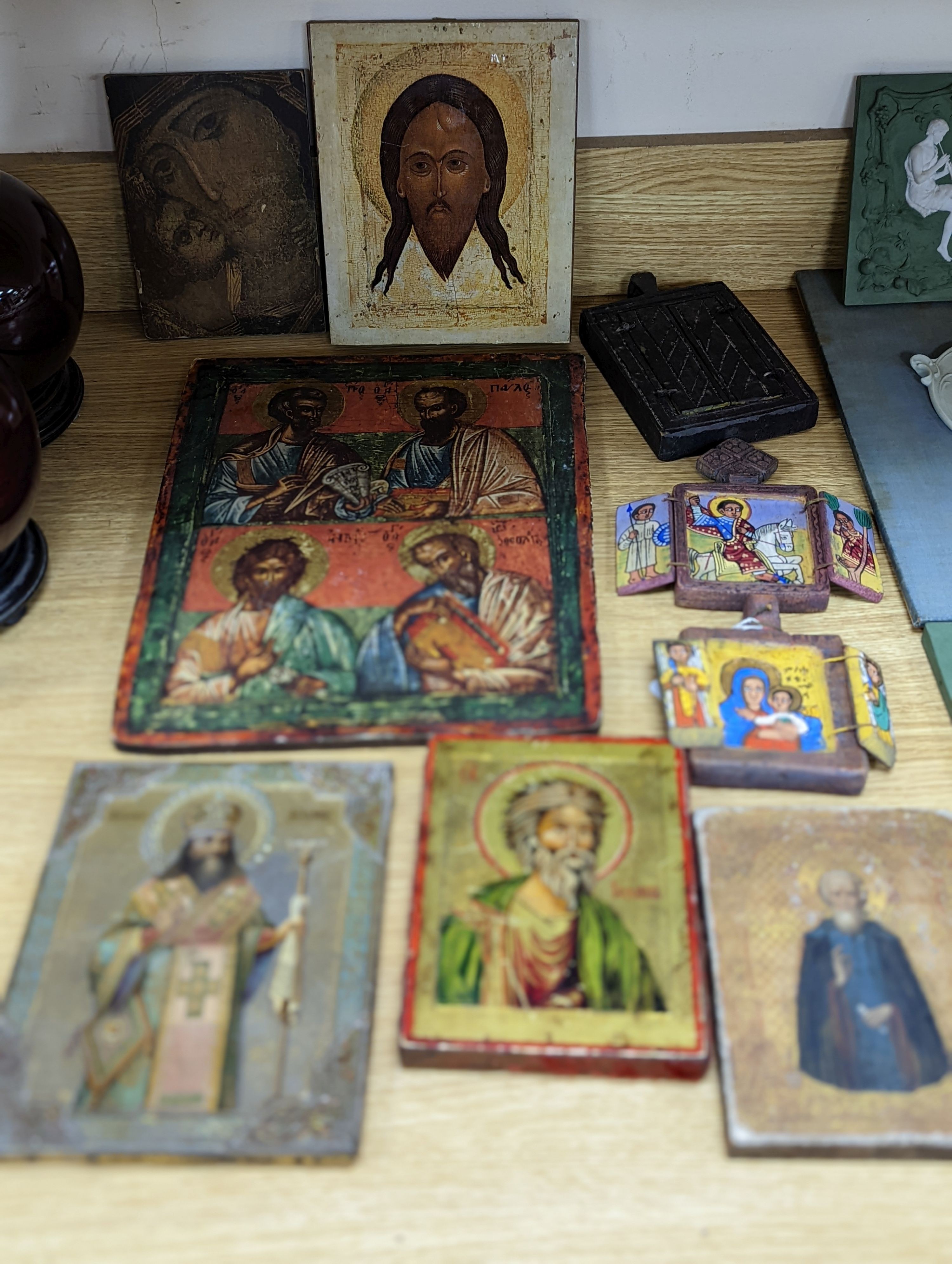 A group of nine assorted icons, largest 37 x 28cm